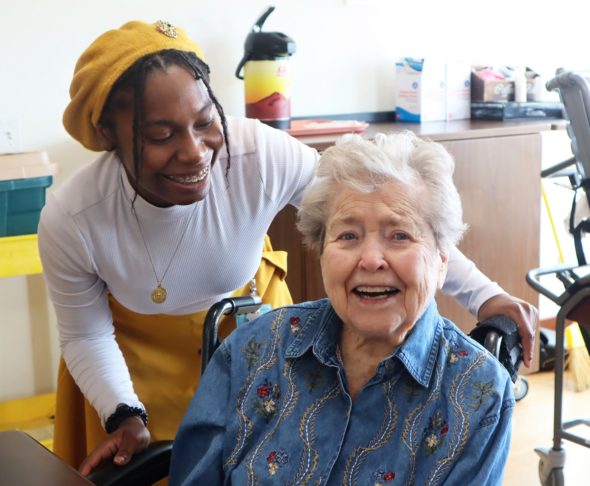 smiling-resident-and-caregiver A resident with a Mission Partner