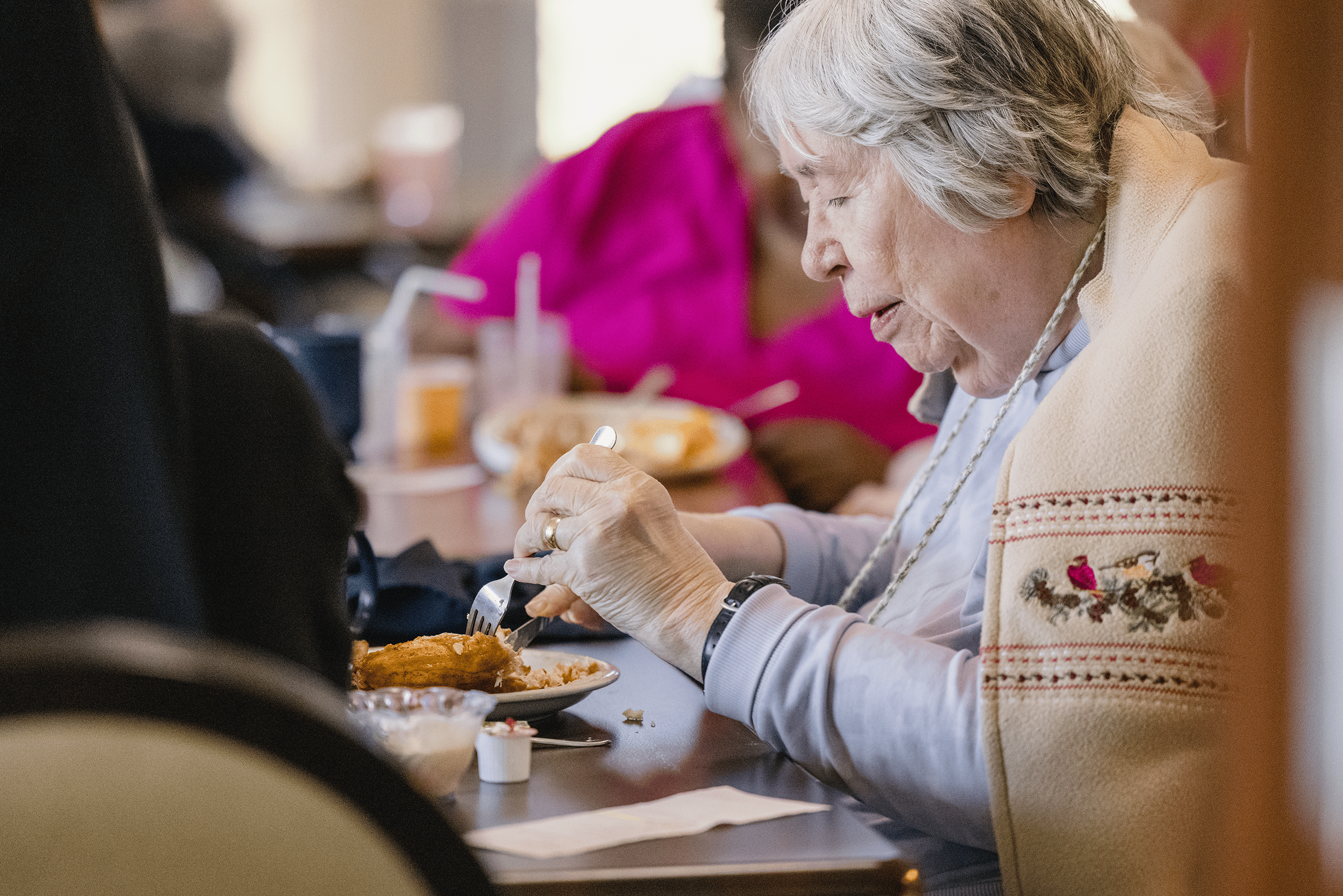 A resident eating her lunch.