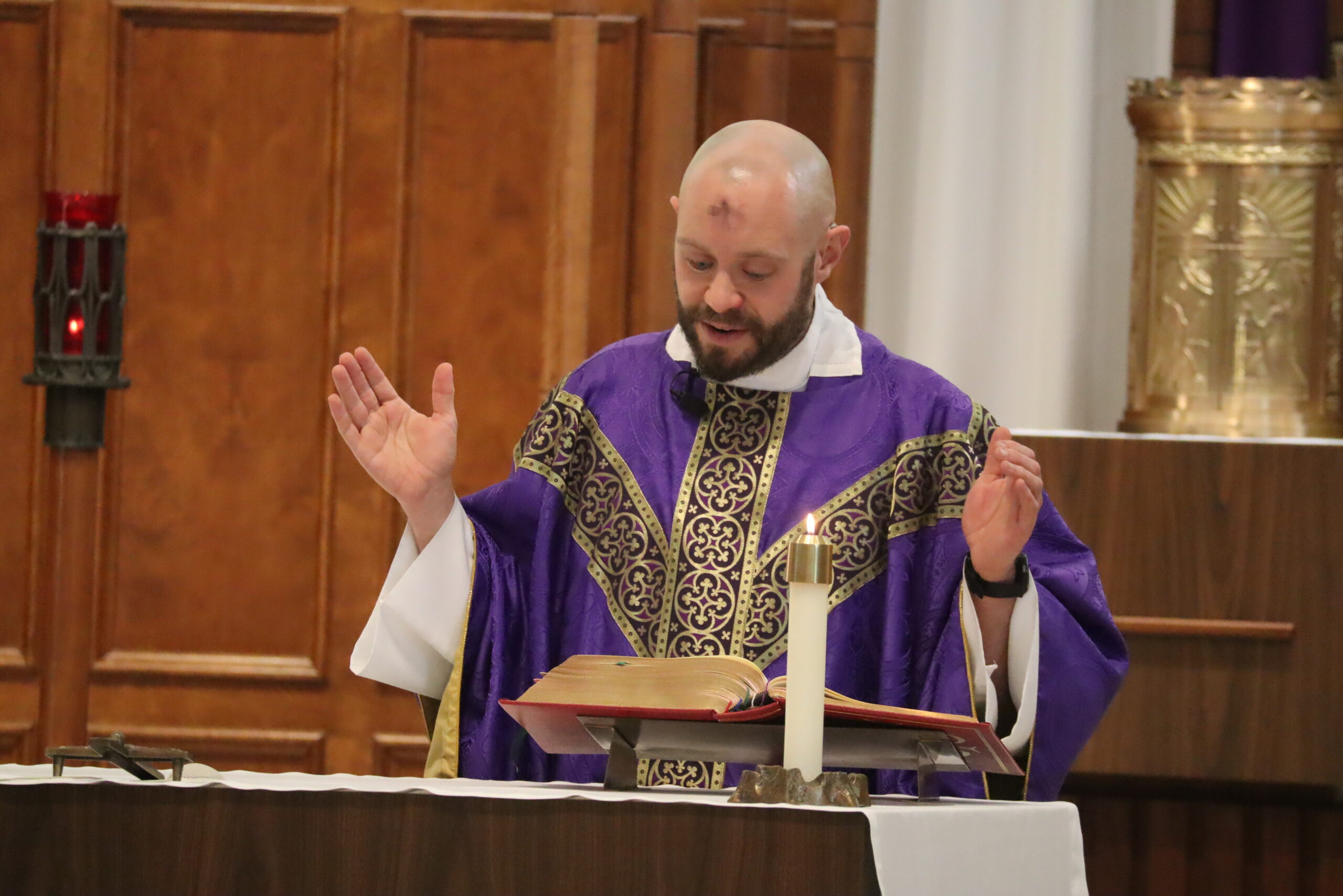 IMG_4223 Father Dan saying Ash Wednesday Mass. He's wearing purple and has ashes on his forehead