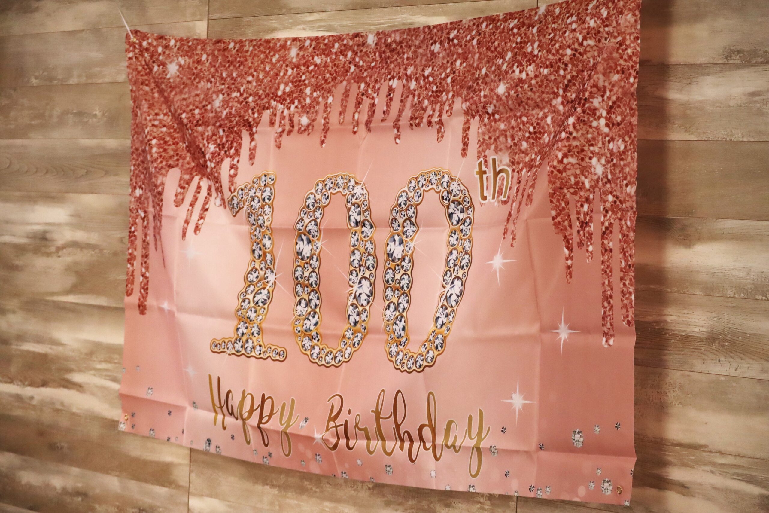 IMG_4271 A banner that says "Happy 100th Birthday"