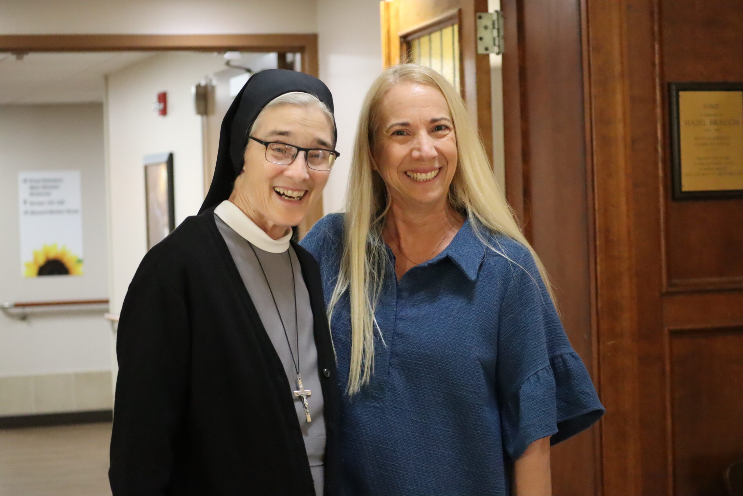 IMG_4284 Sister Michael and a woman posing and smiling